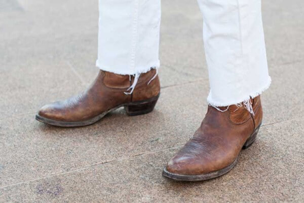 Men's cowboy boots and cutoff white jeans for any occasion