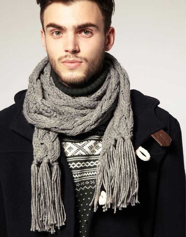 Stylish gray knitted scarf for men for winter season with blue coat