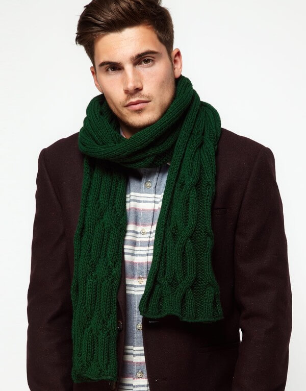Men's green knitted scarf under a burgundy coat for winter season