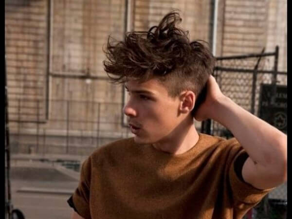 Messy long faux hawk spikes hairstyle for men