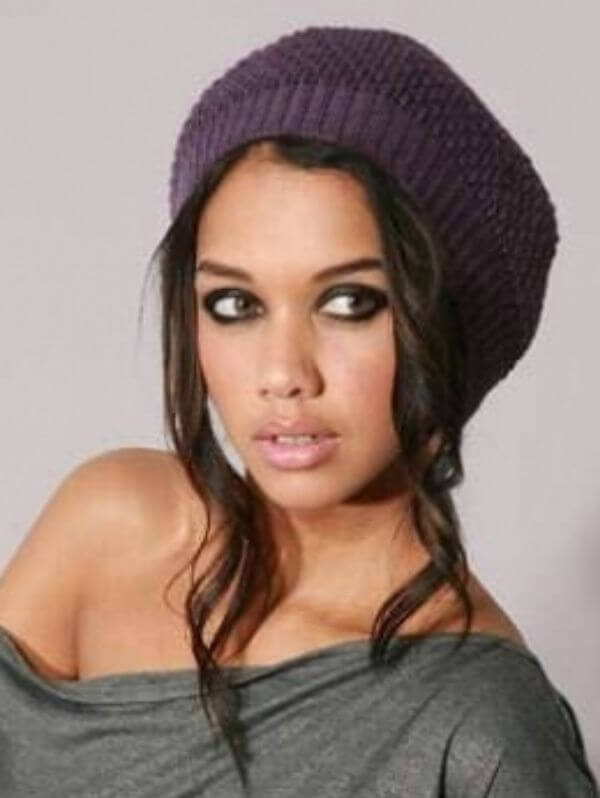 Women's hairstyles under a purple knitted hat in the winter