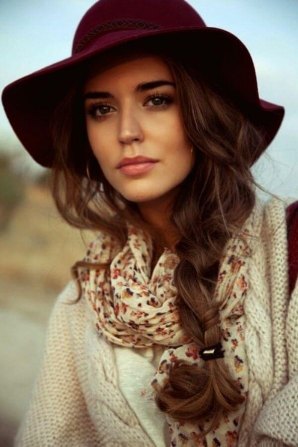 Women's side braid with burgundy hat for casual look
