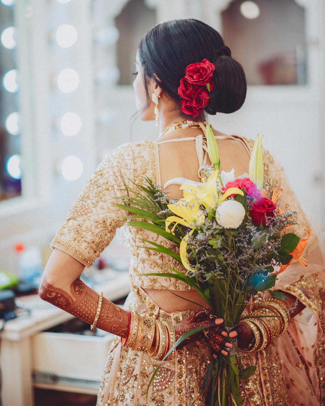  Minimalism: Floral Bun Hairstyles for Brides this Wedding Season