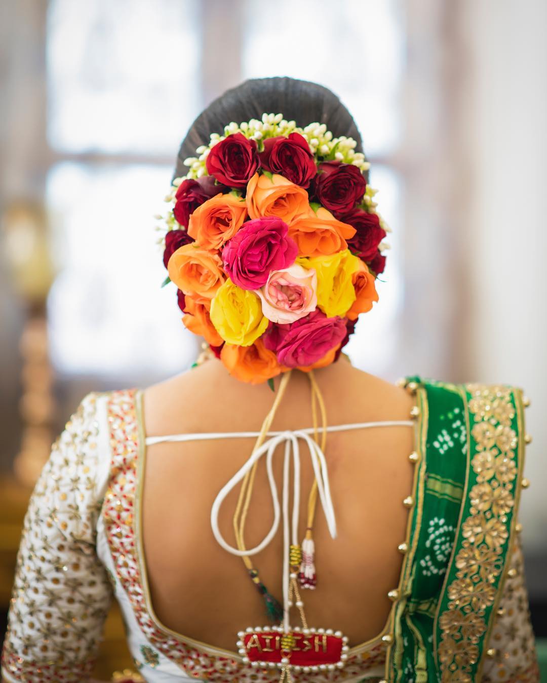 Rose overdose: Floral Bun Hairstyles for Brides this Wedding Season