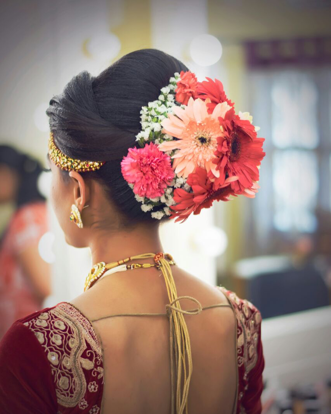 Top 15 Floral Bun Hairstyles for Brides this Wedding Season
