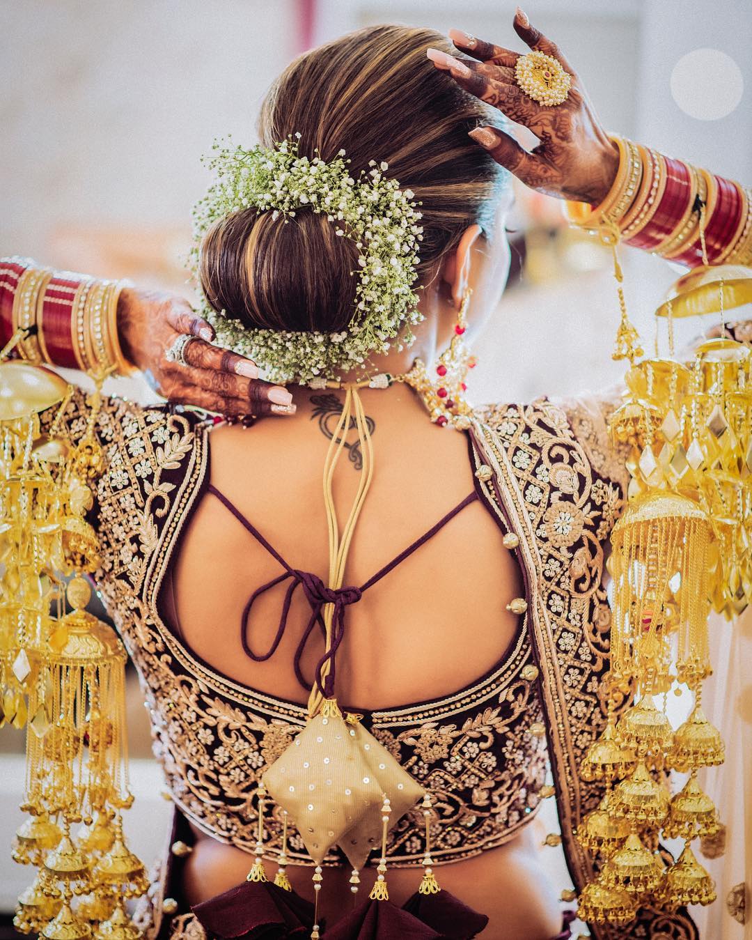 Flowery magic: Floral Bun Hairstyles for Brides this Wedding Season