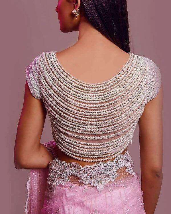 The intricately beaded back blouse design Fancy Saree Blouse Back Neck Designs for Indian Women