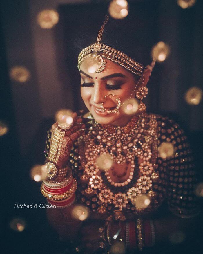 A nath with pearls with Matha Patti Latest Bridal Nath Designs for Traditional Indian Wedding