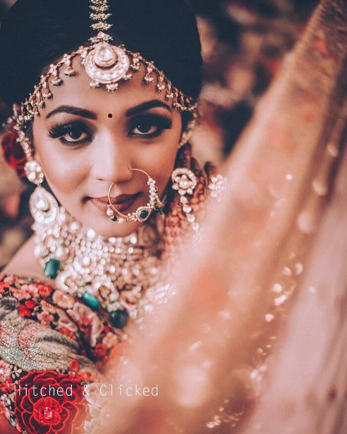A nath with intricate details Latest Bridal Nath Designs for Traditional Indian Wedding