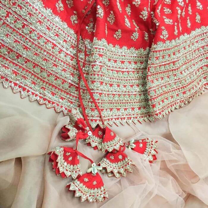 Beautiful basic design red latkans tassel bridal lehenga