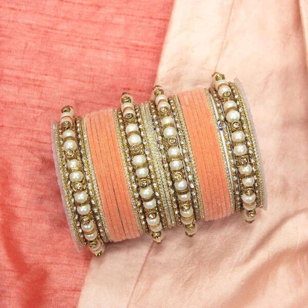 Beautiful peach bangles with pearl kadas Trendy Bangle Designs for Indian Brides to Make Your Wedding Memorable