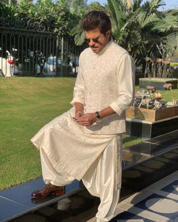  Father of the Bride Outfit Ideas Anil Kapoor ivory coloured patiala suit with a nehru jacket of the same colour and brown shoes