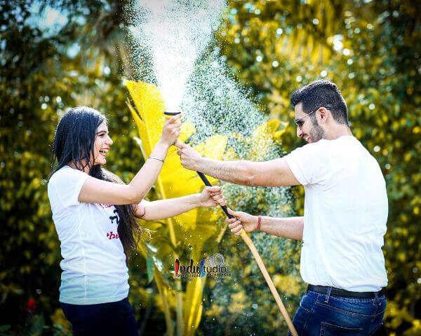 Water splashes pre-wedding photoshoot for couples Pre-wedding Photoshoot Ideas for Indian Couple