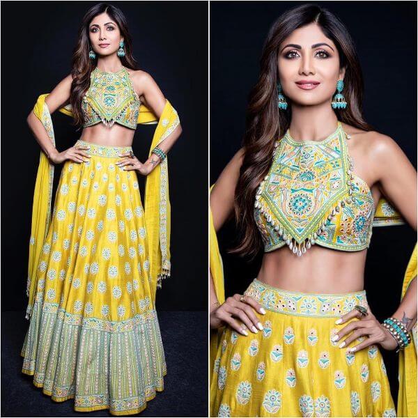 Shilpa Shetty's yellow halter-neck multi hued flower embroidered lehenga with matching multi-hue yellow dupatta