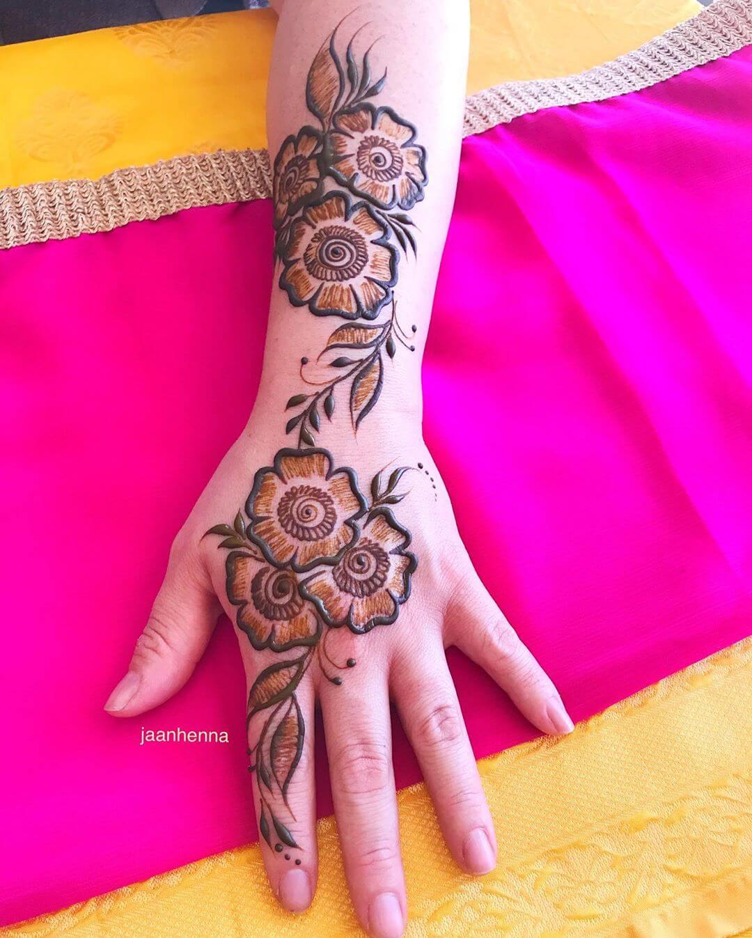 A Dazzling Garland Shaded Mehndi Designs for Back Hand