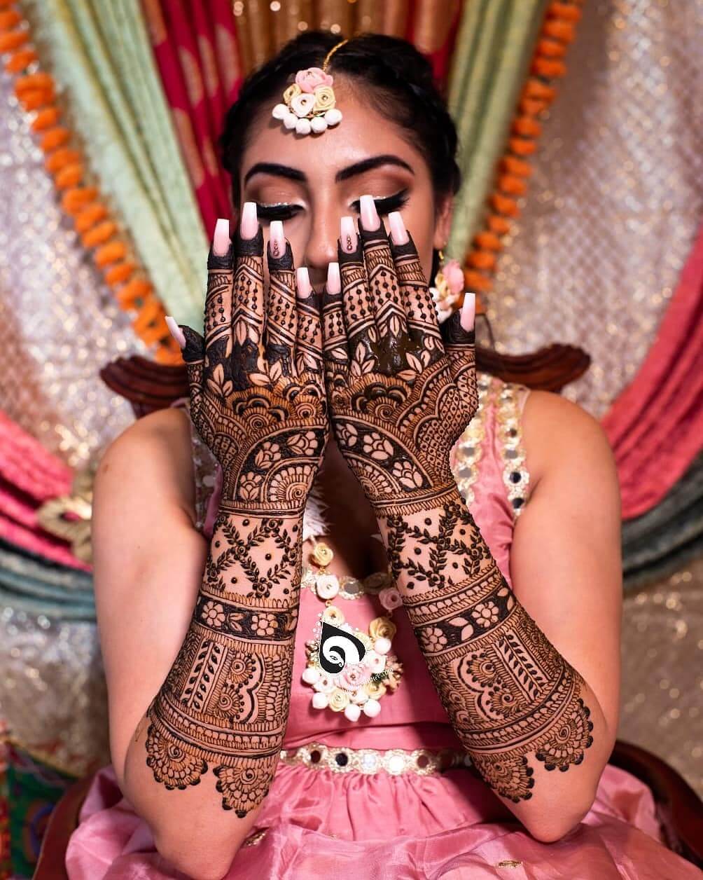 Magnificent Floral Entwined Bridal Back Hand Mehndi Design