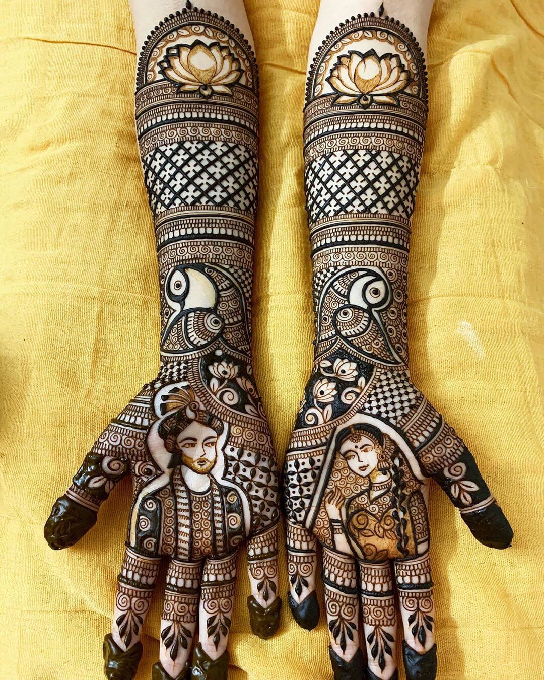 Fashioning full henna designs for the bride's hands.
