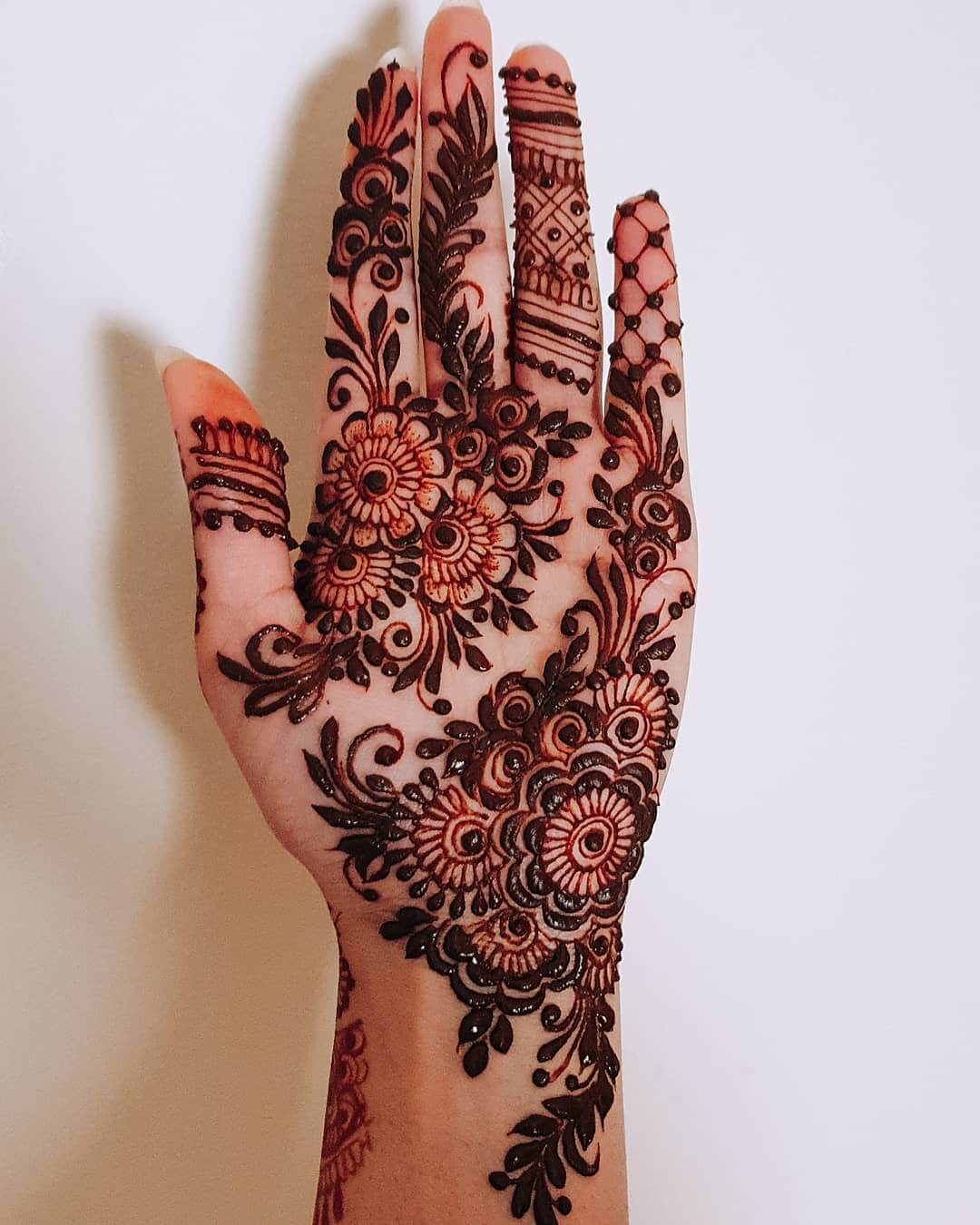 Daring floral motifs for dazzling brides and bridesmaids Half Hand Mehndi Design