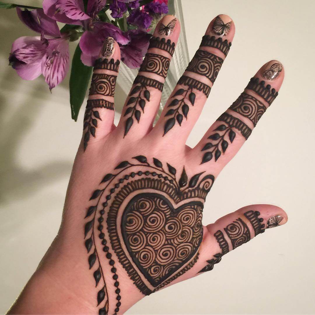 Charming heart mehndi design for back of the palm