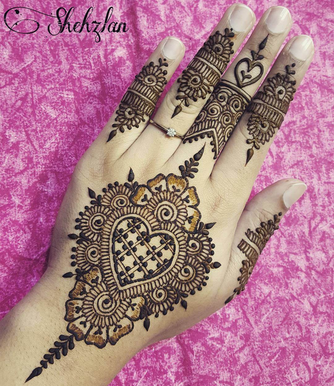 Angelic heart mehndi design for back of the palm