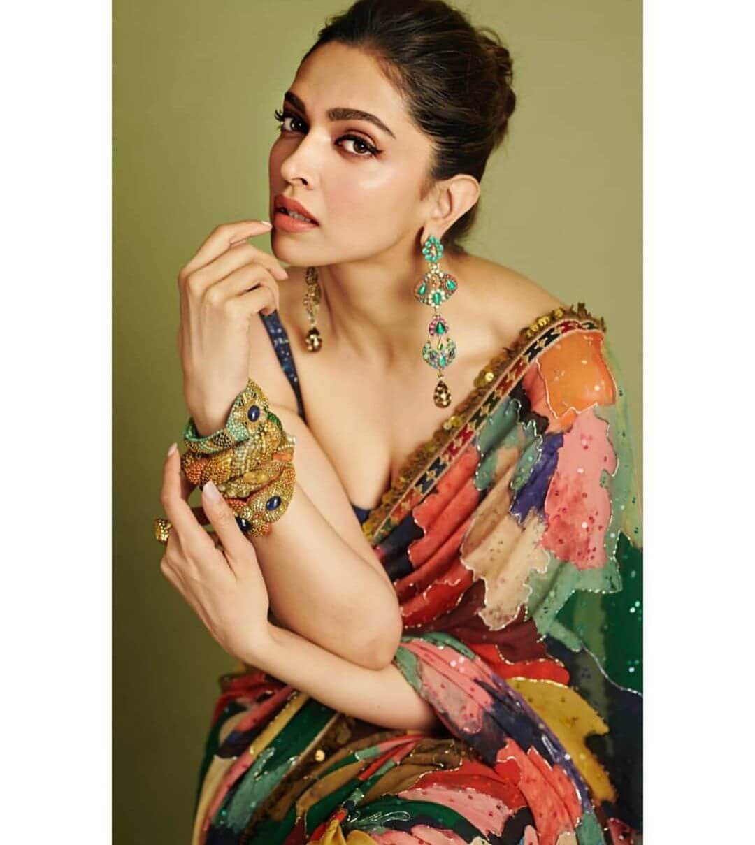 Deepika Padukone’s multicolored bangles on the hand or the emerald studded earrings
