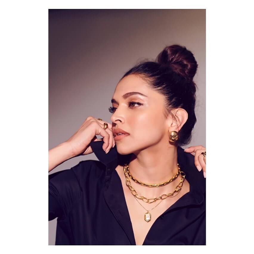 Deepika Padukone’s gold tops, ring, chain and a pendant.
