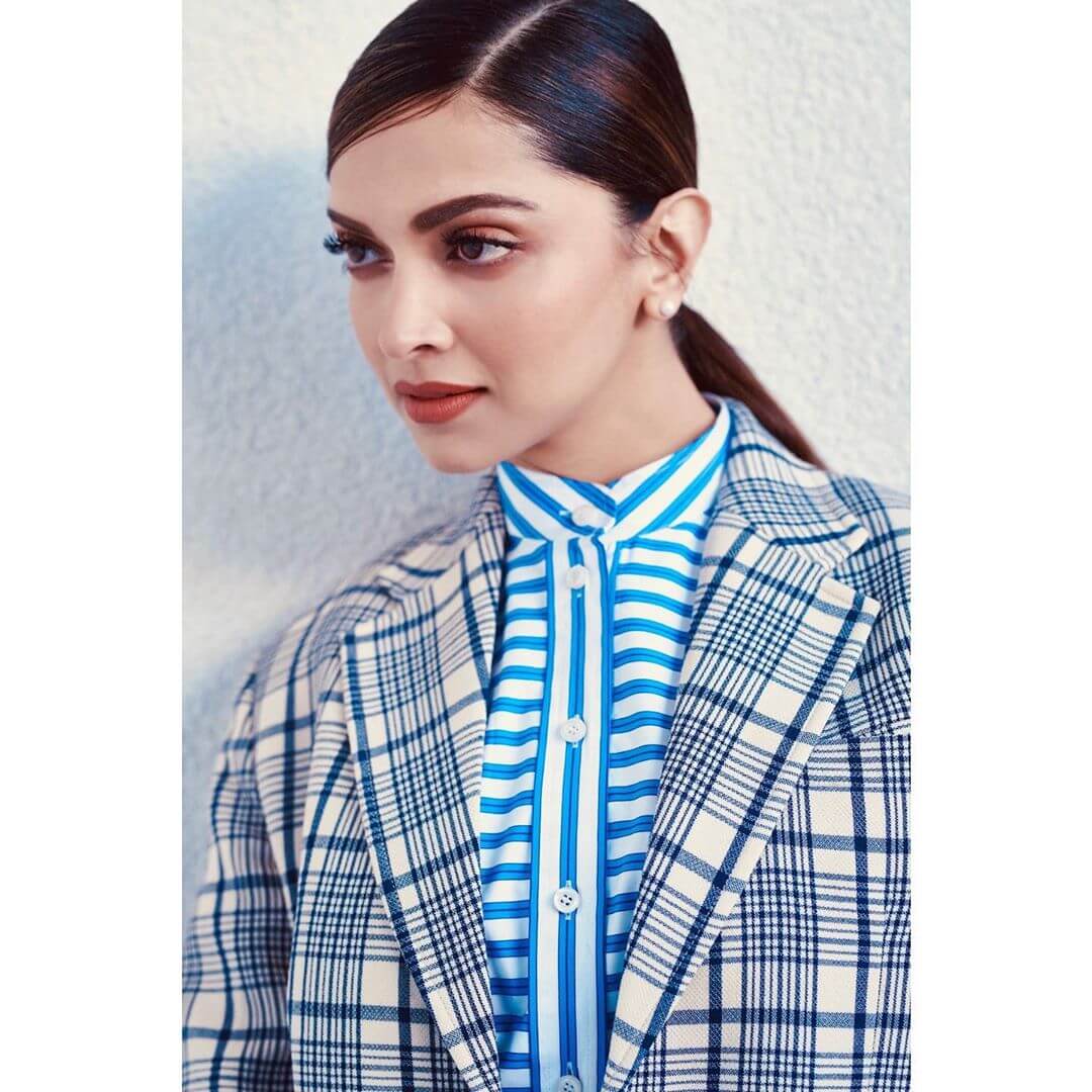  Deepika Padukone’s pearl earring with sky blue colored shirt and a checkered blazer