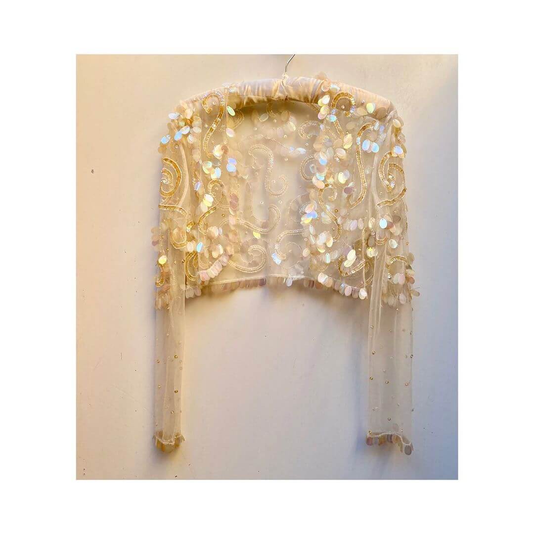 Add glitter to an outfit with a sequin shrug fun with sequin