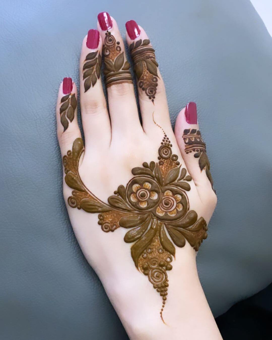 Floral and Curves mehndi designs for back hands