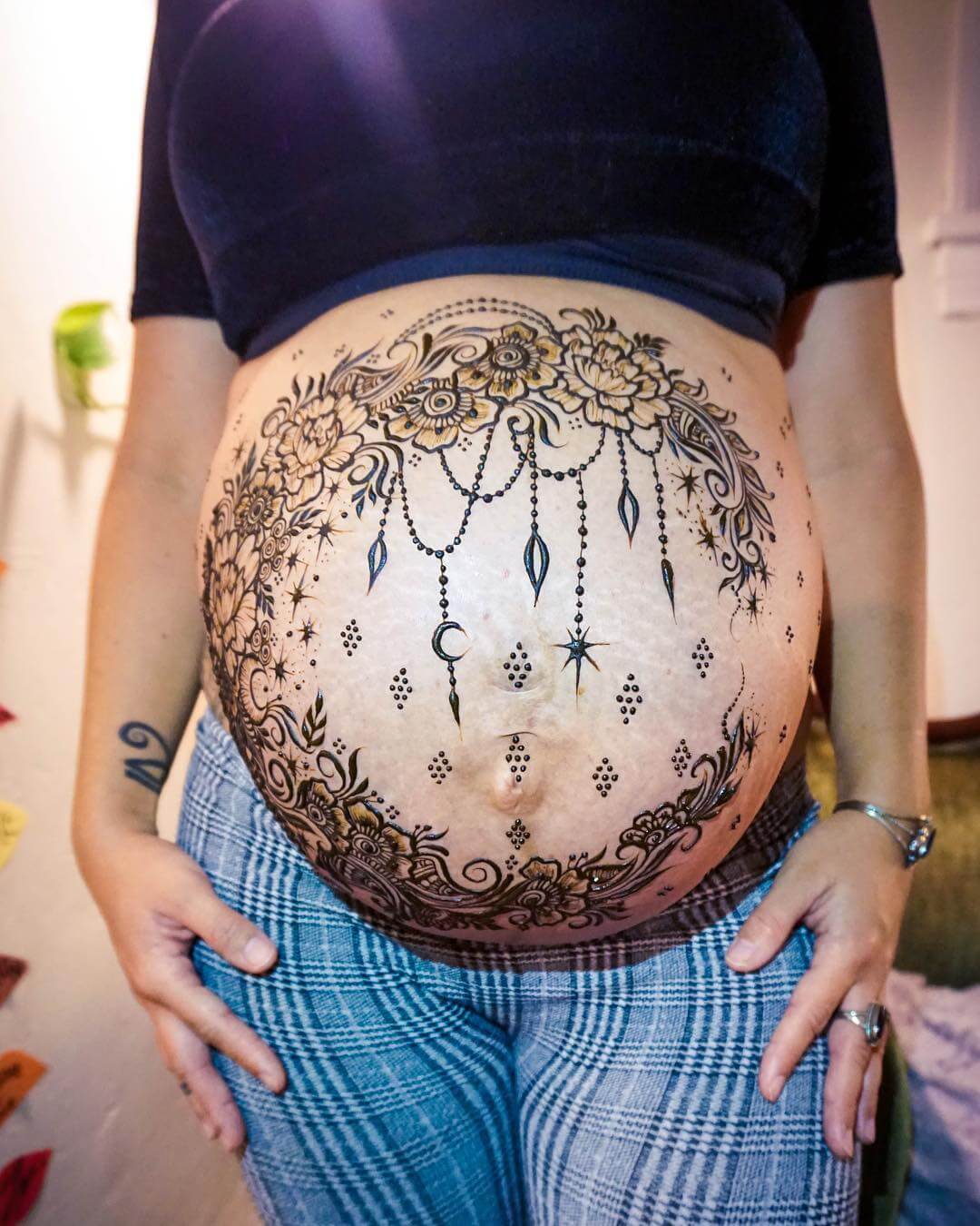 Hanging moons, stars and flowers Amazing Pregnant Belly Henna Designs