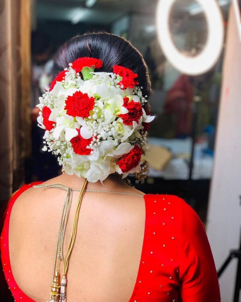 Next up for the brides who LOVES bun as a hairstyle! Accentuating it with a  saree , lehenga or even a gown – a messy bun with some floral… | Instagram