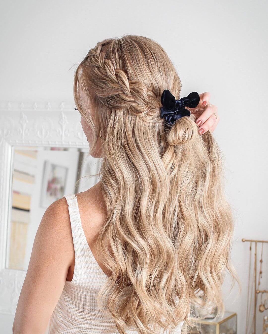 Loose braid styled with a bow