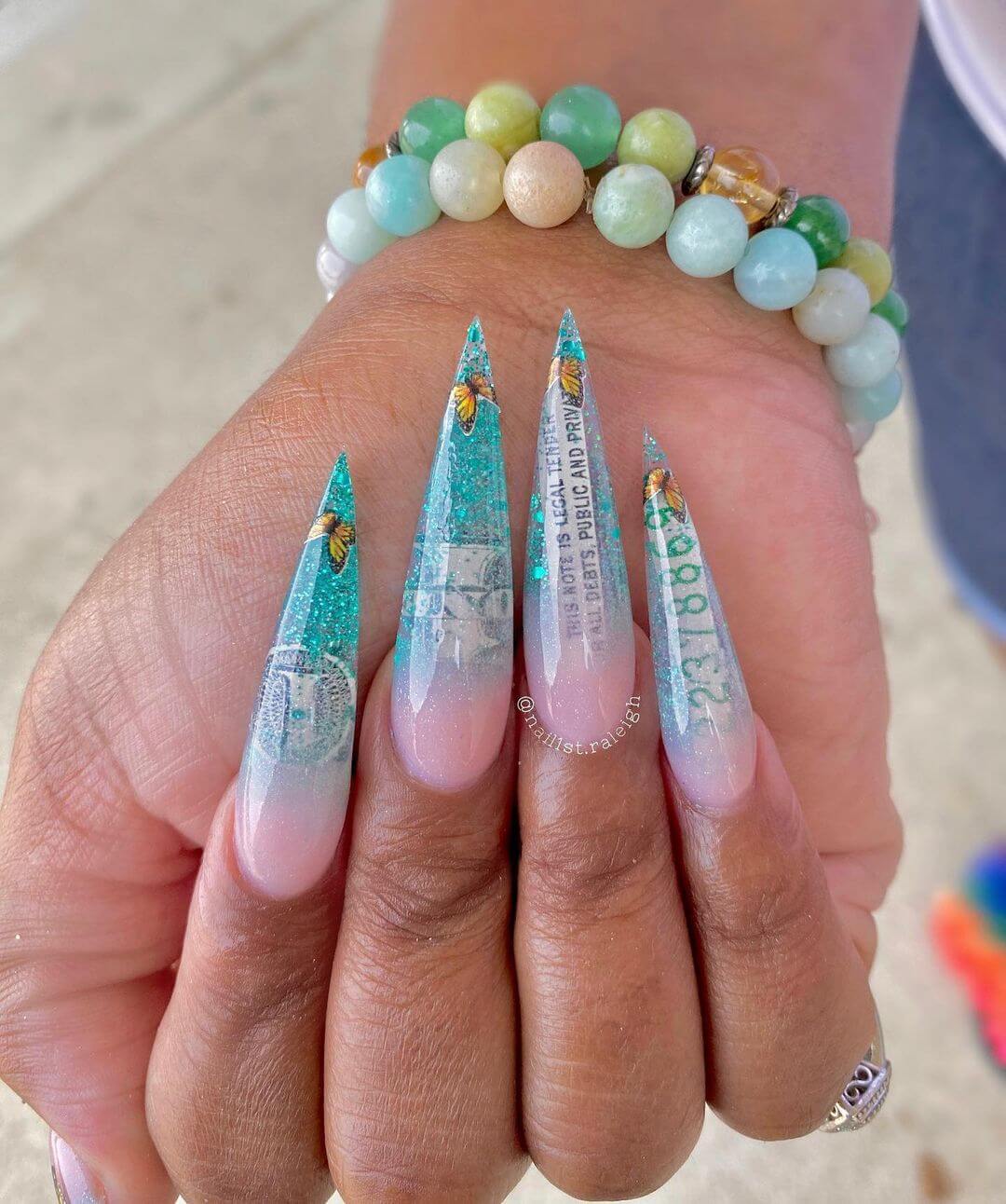 Dollar nail art design in pink and blue
