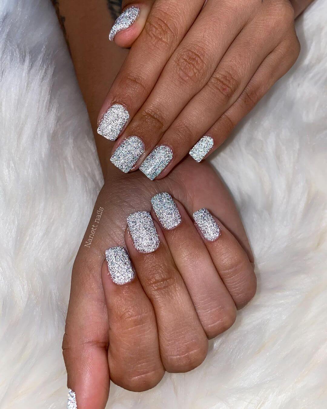 Shining glittered silver nail art work