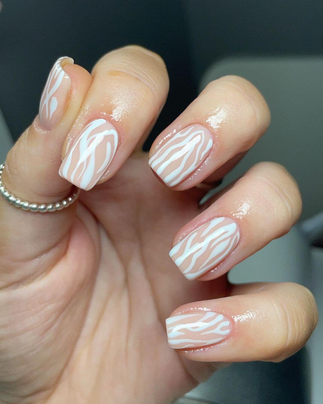 Zebra stripes inspired nail art in white