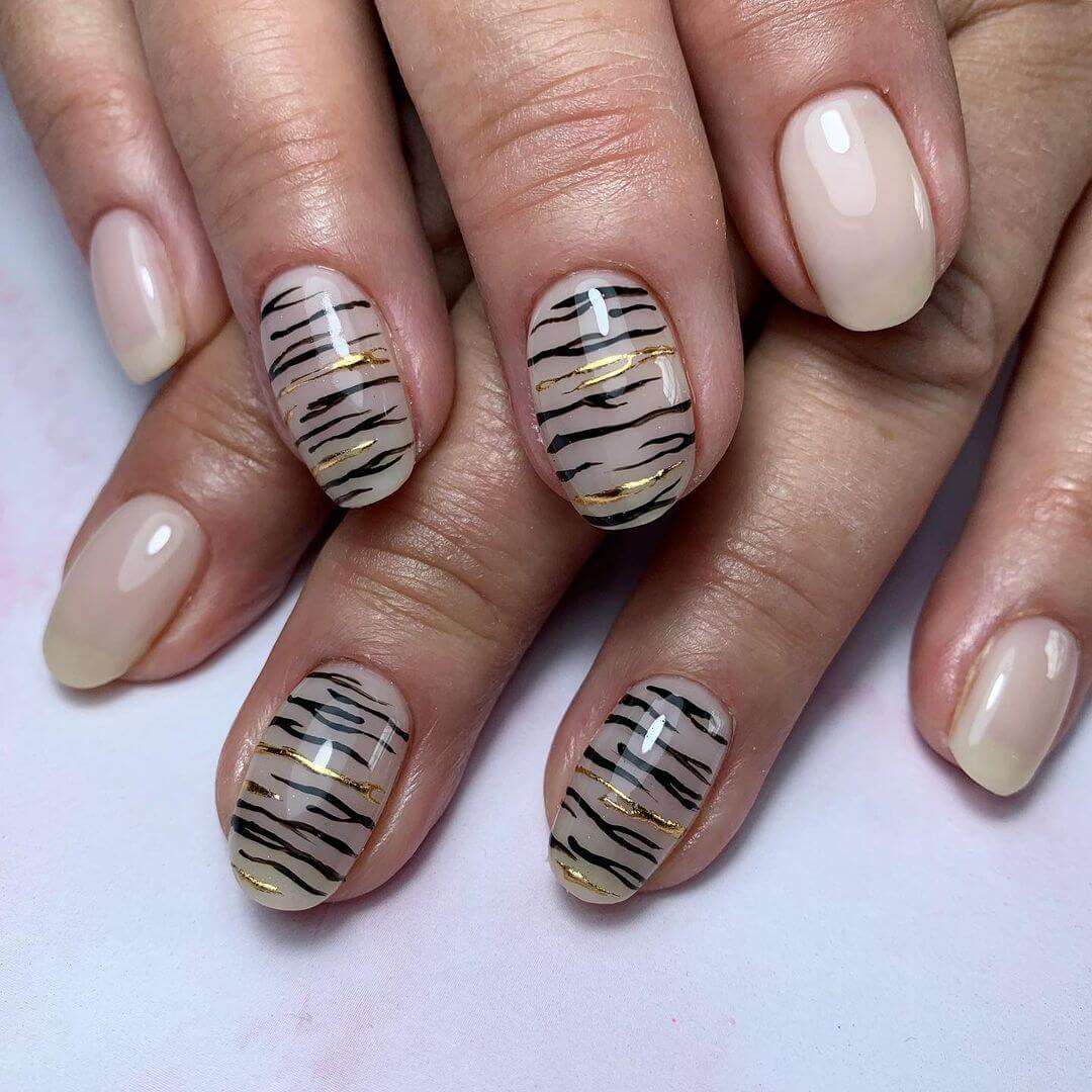 Gold foil zebra nail art