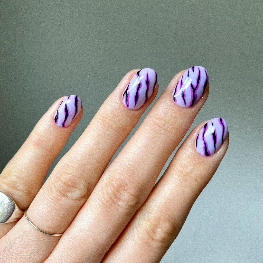 Zebra nail art in violet