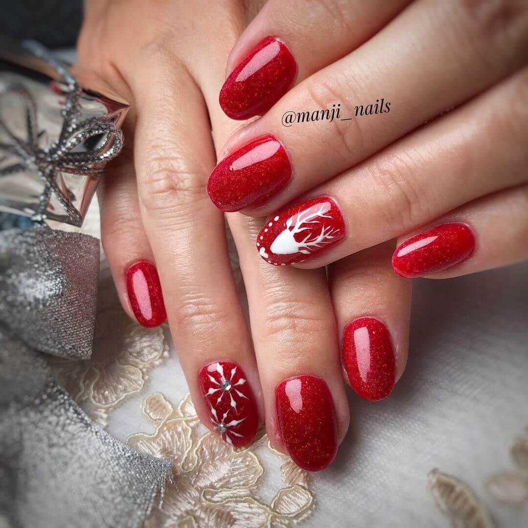 Christmas Nail Art Designs Reindeer and snowflakes with red background