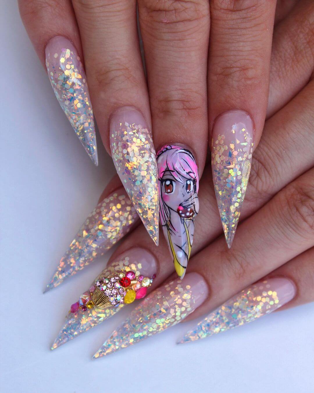 Girl eating cupcakes with sequinned nail art