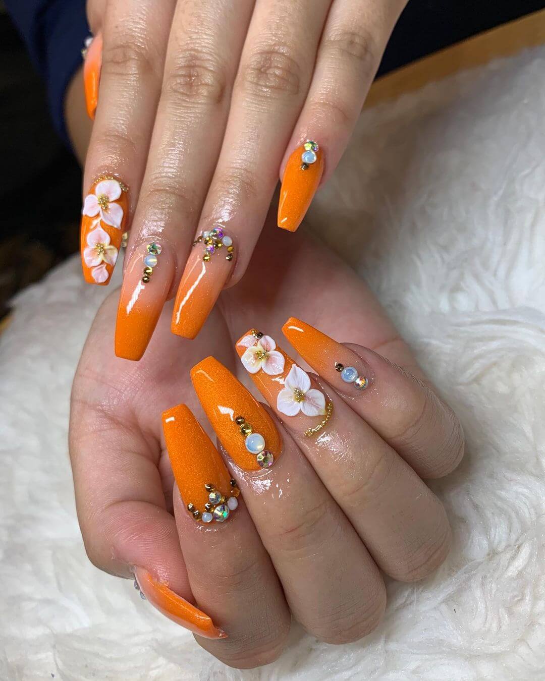 Orange colour with floral nail art