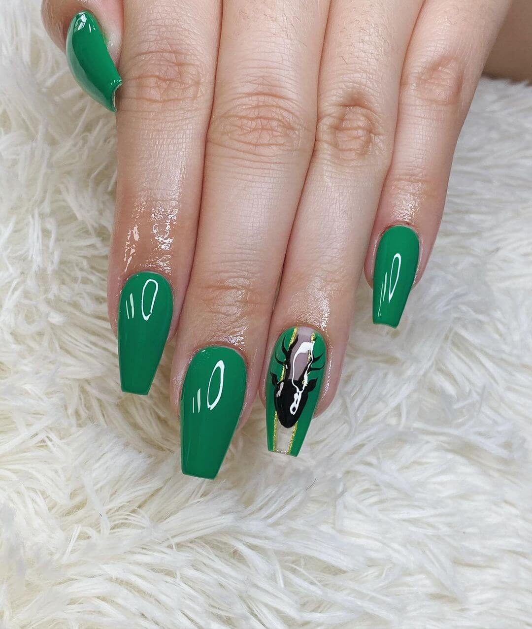 Black reindeer on green nail art design