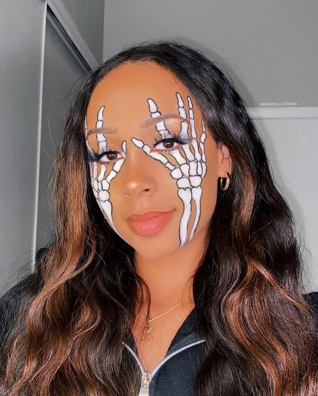 Women's Halloween Makeup Skeleton hands protect your face
