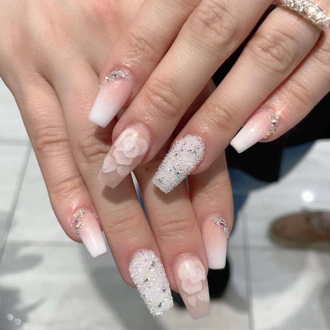 Crystal Nail Art Designs White colour and crystal nail art is modest