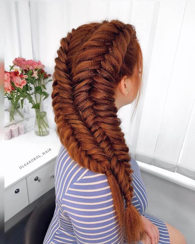 Thick fishtail braids on the flaming hair