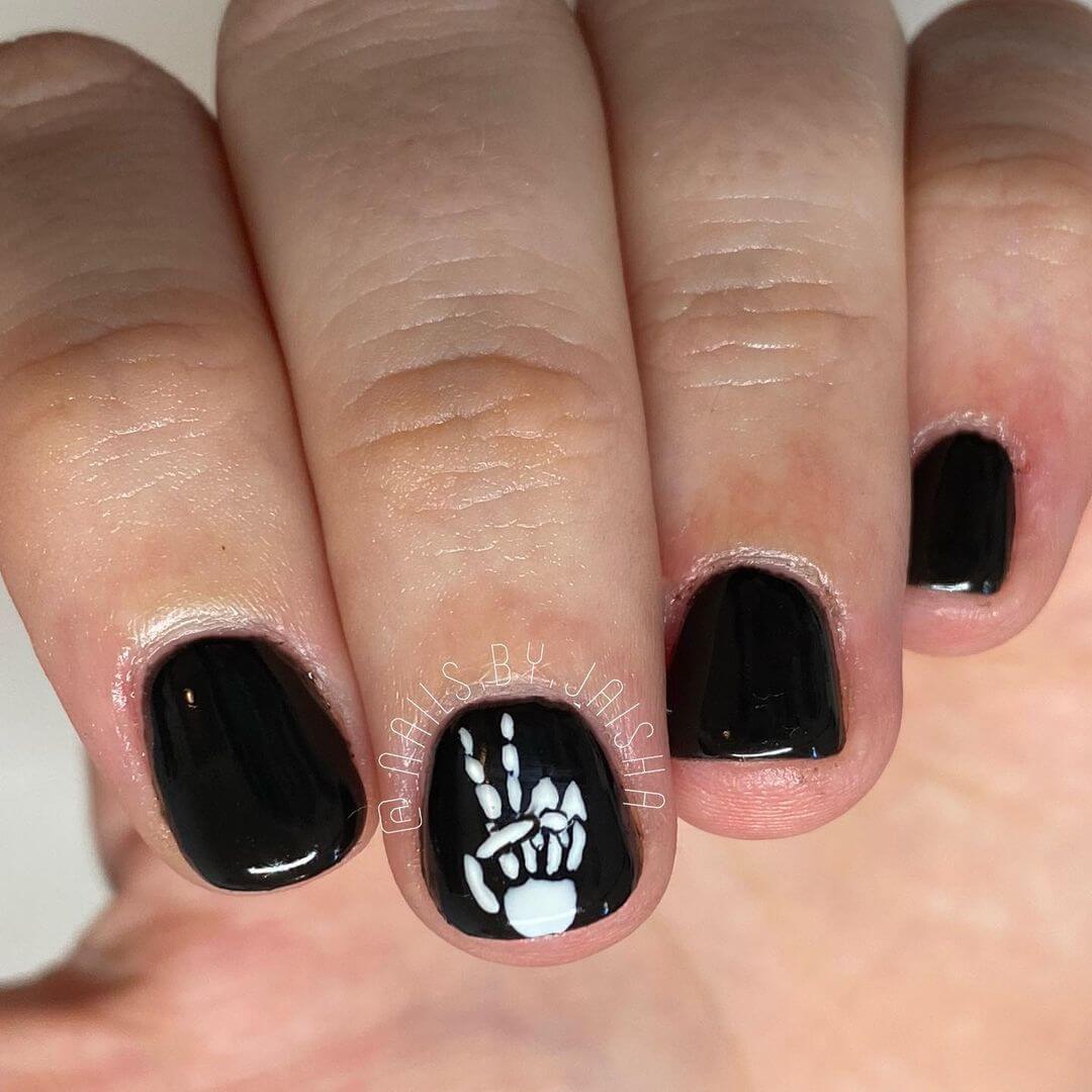 Halloween Nail Art Designs Skeleton hand giving a cool pose is frightening