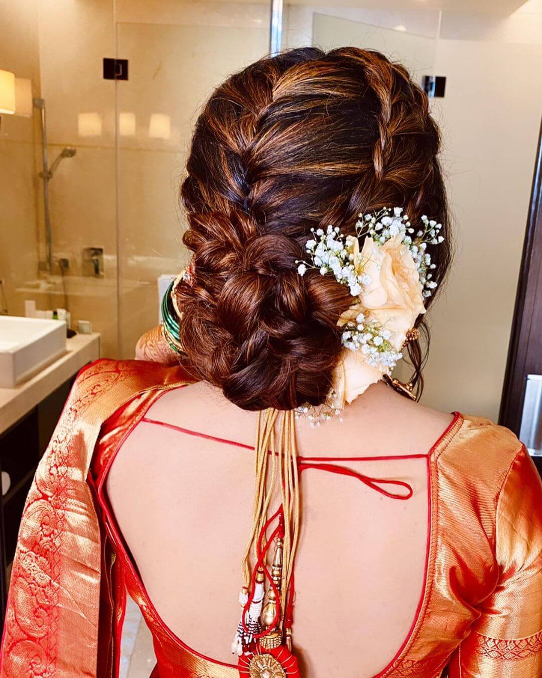 Side braided bun bridal hairstyle