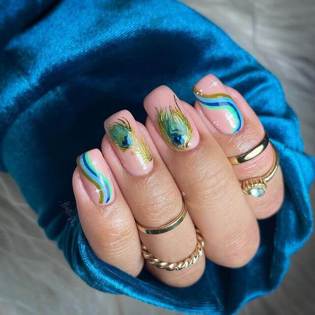 Peacock Feather Theme with Stars and Waves Nail Art Design