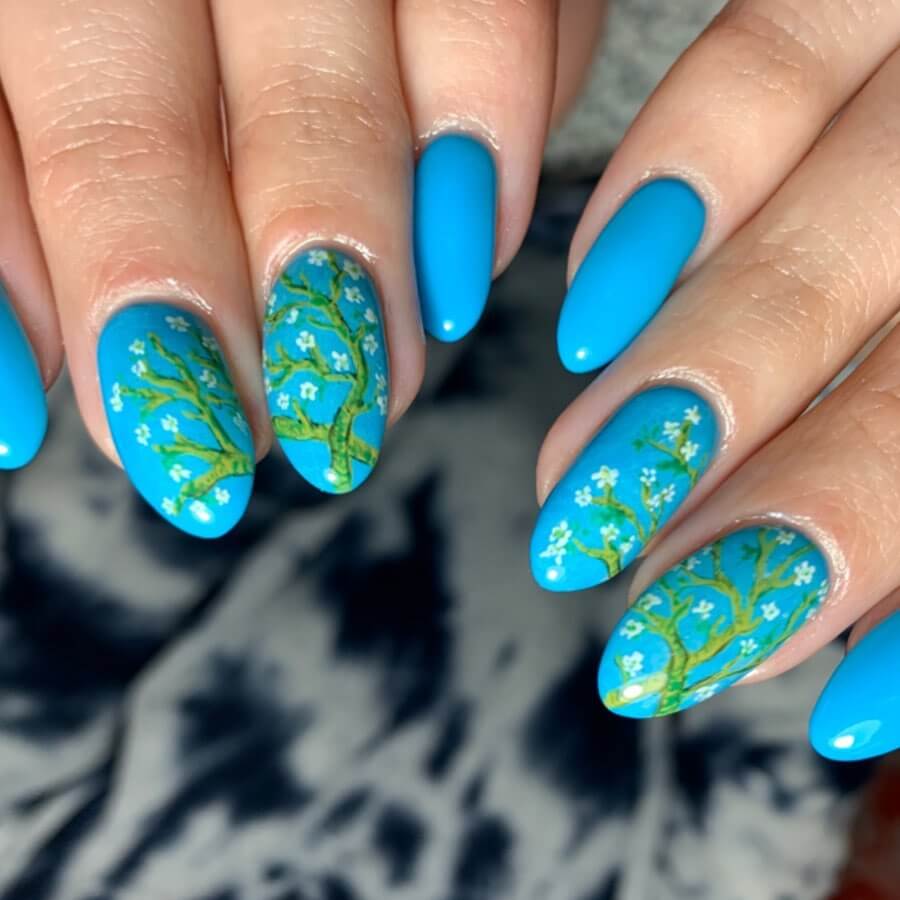 Vibrant Blue Cherry Blossom Nail Art Design