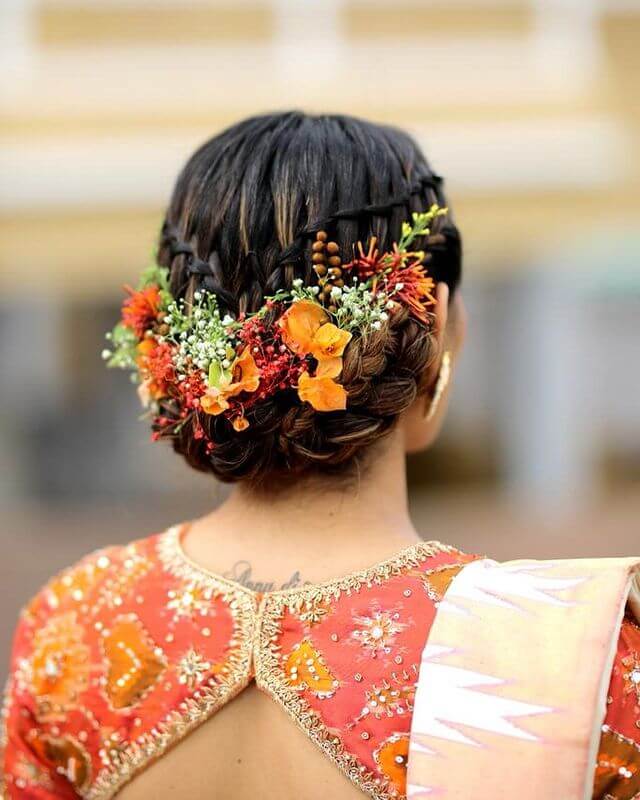 Quirky Bridal Bun with Orange Flowers Best of Braided Bun Hairstyles for the Beautiful Bride