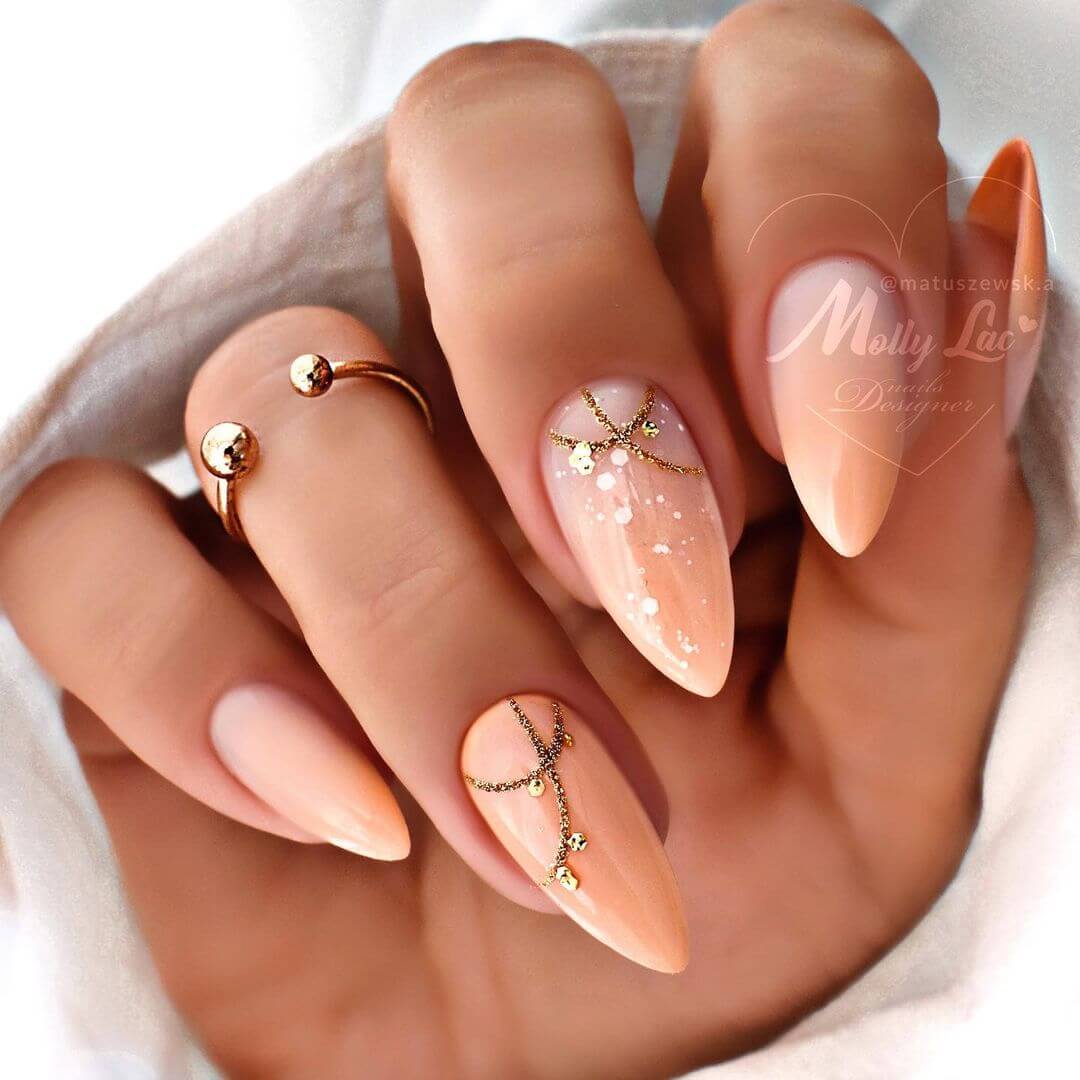 Stylish Peach Nail Art with Golden Decorations